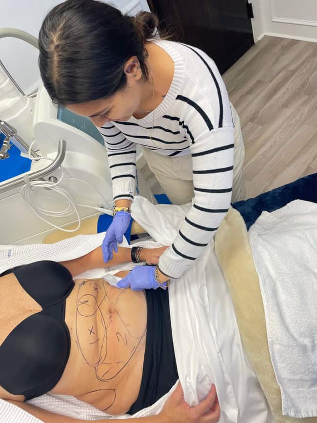 CoolSculpting provider massaging after treatment at Element Body Lab
